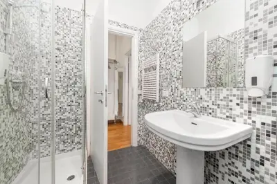 a bathroom with a sink and a shower at Irpini in Rome
