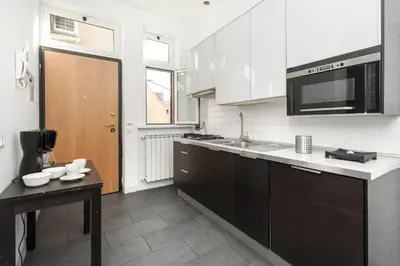 a kitchen with a sink and a microwave at Irpini in Rome