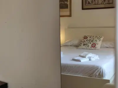 a bedroom with a bed with towels on it at La Terrazza del Poeta in Rome
