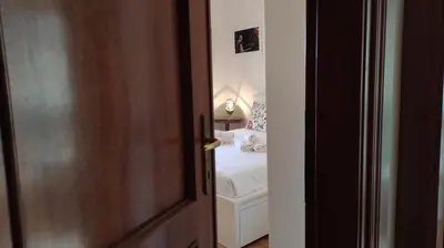 an open door to a bedroom with a bed at La Terrazza del Poeta in Rome