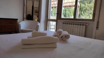 a pile of towels sitting on top of a table at La Terrazza del Poeta in Rome