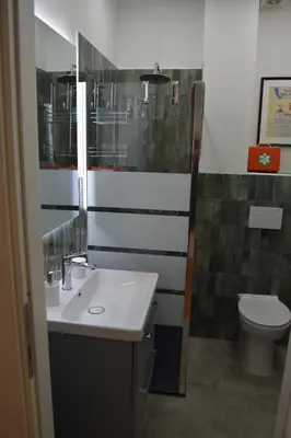 a bathroom with a sink and a toilet at Casa Luminosa in Monteverde in Rome
