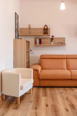 a living room with a couch and a chair at San Giovanni Al Colosseo in Rome