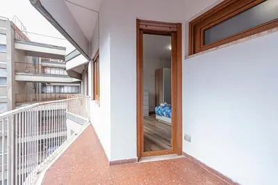 a staircase with a wooden door in a building at San Giovanni Al Colosseo in Rome