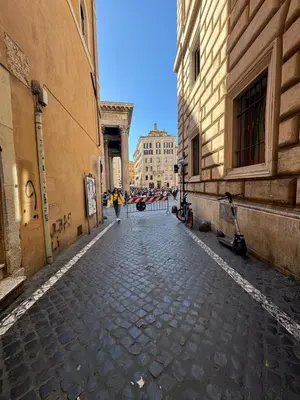 a cobblestone street in an alley between two buildings at New! Renovated Apt in Ancient Rome in Rome