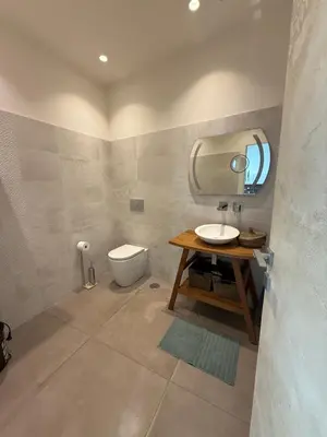 a bathroom with a sink and a mirror and a toilet at loft Trastevere in Rome
