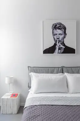 a black and white picture of a man smoking a cigarette at Trastevere Modern 4BR 4baths, WIFI, AC, custom kitchen, living room in Rome