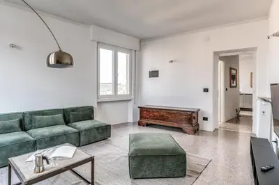 a living room with a couch and a table at Amazing Piramide Metro Station in Rome