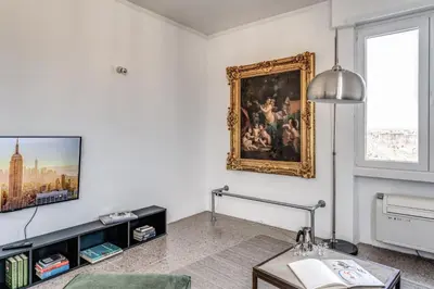 a living room with a painting on the wall at Amazing Piramide Metro Station in Rome