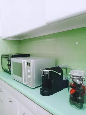 a kitchen counter with a microwave and other appliances at Domus Remo Room #2 in Rome