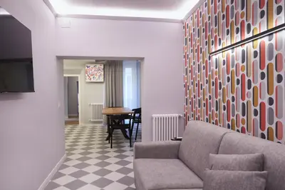 a living room with a couch and a table at RipettArt Apt in Rome