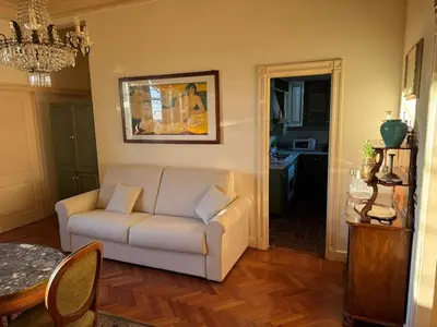 a living room with a couch and a table at Terrace of the Aureli in Rome