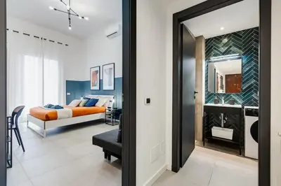 a bedroom with a bed and a room with a mirror at BDC - Stairway to Heaven in Rome