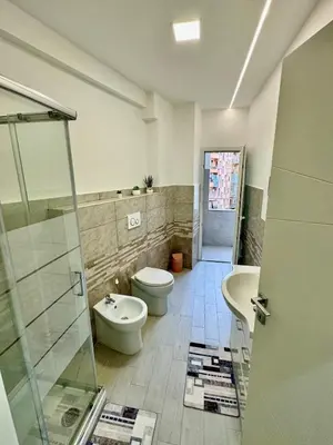 a bathroom with a toilet and a sink at holiday home modern 2 rooms near colosseo in Rome