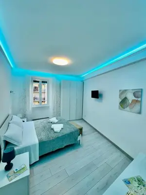 a bedroom with a bed and a blue ceiling at holiday home modern 2 rooms near colosseo in Rome