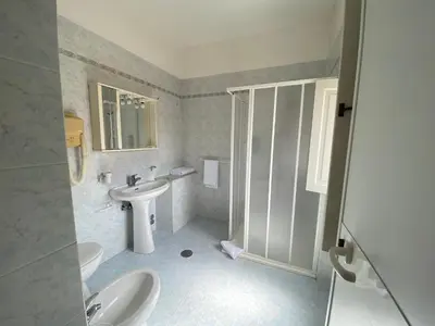 a bathroom with a sink and a toilet and a shower at Casa per Ferie Suore Salesiane dei Sacri Cuori in Rome