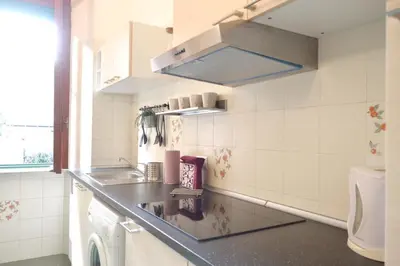 a small kitchen with a sink and a toilet at Holy Vatican Home in Rome