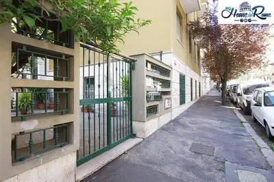 a building with a gate on the side of a street at Holy Vatican Home in Rome