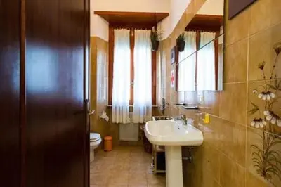 a bathroom with a sink and a toilet at Holy Vatican Home in Rome