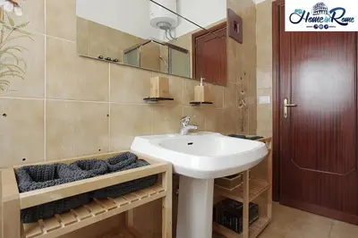 a bathroom with a sink and a mirror at Holy Vatican Home in Rome
