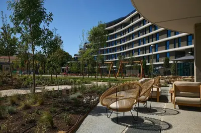 a group of chairs sitting in front of a building at The Social Hub Rome Extended Stay in Rome