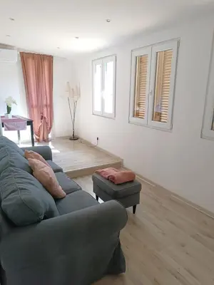 a living room with a couch and a table at Jeb's Sweet Rooftop in Rome