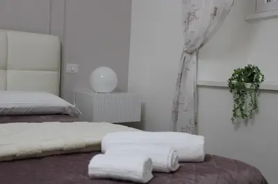 a bedroom with a bed with towels on it at Apartment near the Vatican in Rome