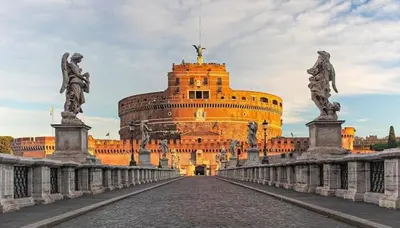 a large building with a bridge in front of it at Apartment near the Vatican in Rome