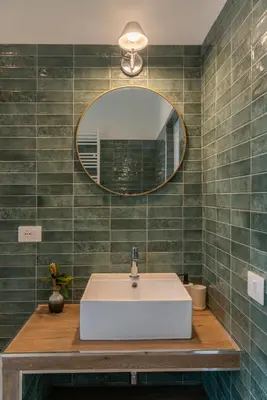 a bathroom with a white sink and a mirror at Penthouse Vado Collection in Rome