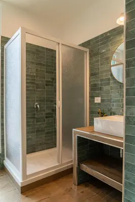 a bathroom with a shower and a sink at Penthouse Vado Collection in Rome