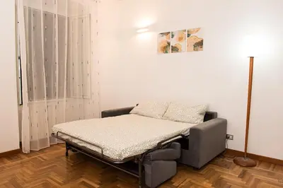 a hospital bed in a room next to a window at Braliu Apartment in Rome
