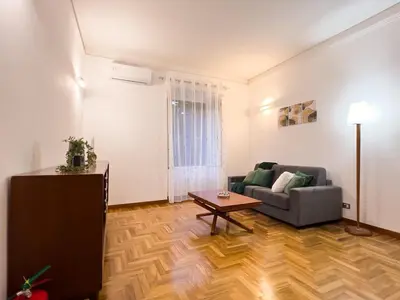 a living room with a couch and a table at Braliu Apartment in Rome