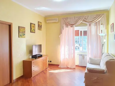 a living room with a couch and a television at Domus Monteverde in Rome