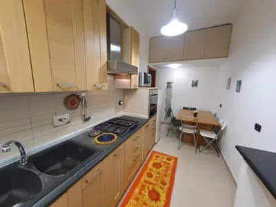 a kitchen with a sink and a stove top oven at Domus Monteverde in Rome