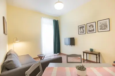 a living room with a couch and a table at Casa Minieri - Viale Mazzini - San Pietro in Rome