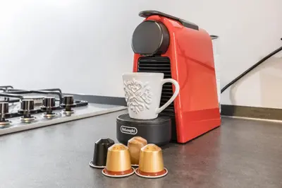 a red toaster sitting on top of a kitchen counter at Casa Minieri - Viale Mazzini - San Pietro in Rome