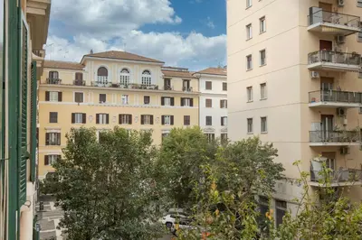 an apartment building with a tree in front of it at Casa Minieri - Viale Mazzini - San Pietro in Rome