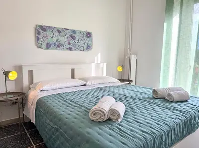 a bedroom with a bed with towels on it at La Dolce Vita - Roman Experience in Rome
