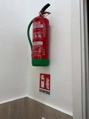 a fire hydrant is hanging on a wall at Domus Romana Prati in Rome