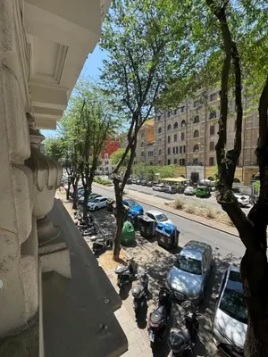 a group of motorcycles parked next to a street at Domus Romana Prati in Rome