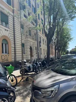 a group of motorcycles parked on a city street at Domus Romana Prati in Rome