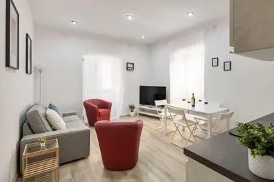 a living room with a couch and a table at central basic apartment in Rome
