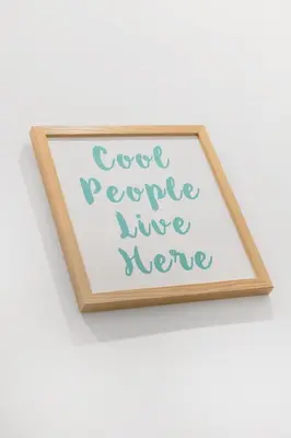 a wooden picture frame with the words people have nerve at central basic apartment in Rome