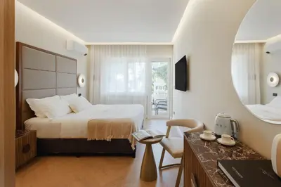 a hotel room with a bed and a mirror at The Romex in Rome