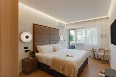 a bedroom with a large bed in a room at The Romex in Rome