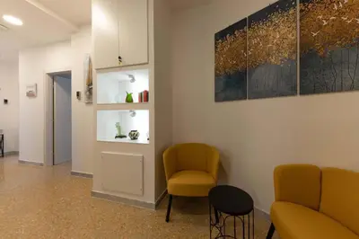 a waiting room with two chairs and a table at auntieshouseroma in Rome