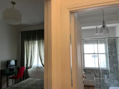 a bedroom with a bed and a window at The Rose Apt in Rome