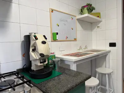 a kitchen with a mixer on top of a counter at ALCAVE holiday home in Rome