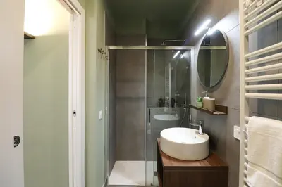 a bathroom with a sink and a shower at LRV Apartment Roma Metro B Conca d'Oro in Rome