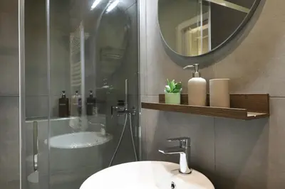 a bathroom with a sink and a mirror at LRV Apartment Roma Metro B Conca d'Oro in Rome